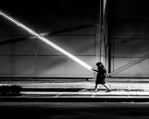 Person walking carefully down the concrete stairs